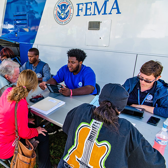 FEMA employees registering disaster survivors for assistance.
