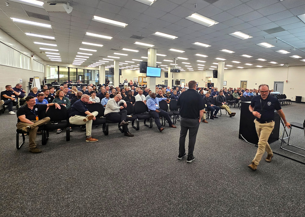 National and regional incident management assistance teams crowd an auditorium to listen to opening remarks for the readiness training.