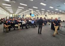 National and regional incident management assistance teams crowd an auditorium to listen to opening remarks for the readiness training.