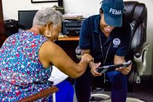 FEMA Disaster Survivor Assistance team talking to a survivor in St. Thomas