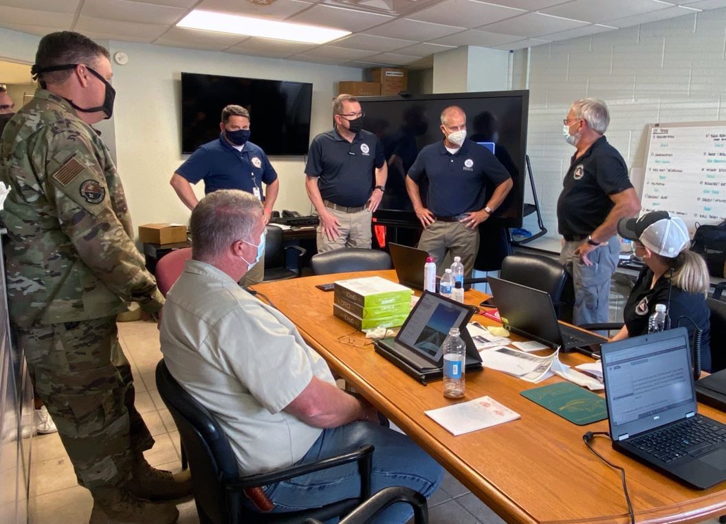 FEMA Administrator Pete Gaynor (standing, 2nd from left) and FEMA’s Region 6 Administrator Tony Robinson (standing, 3rd from left) visits Cameron Parish Office of Homeland Security and Emergency Management to discuss the impact of Hurricane Delta and FEMA's continued effort to support the area.