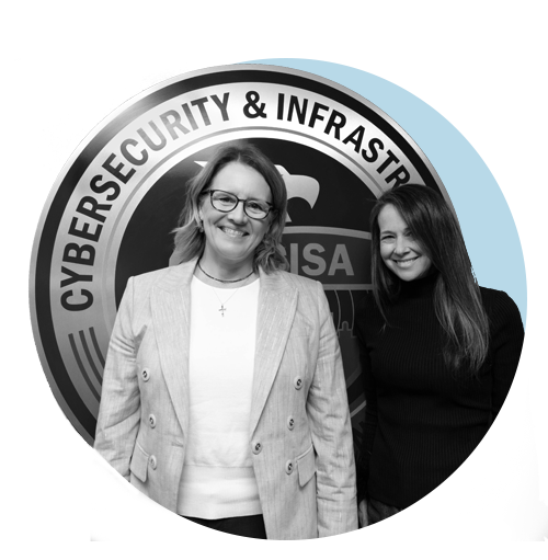 FEMA Administrator Deanne Criswell and CISA Director Jen Easterly smiling and standing in front of the CISA seal.