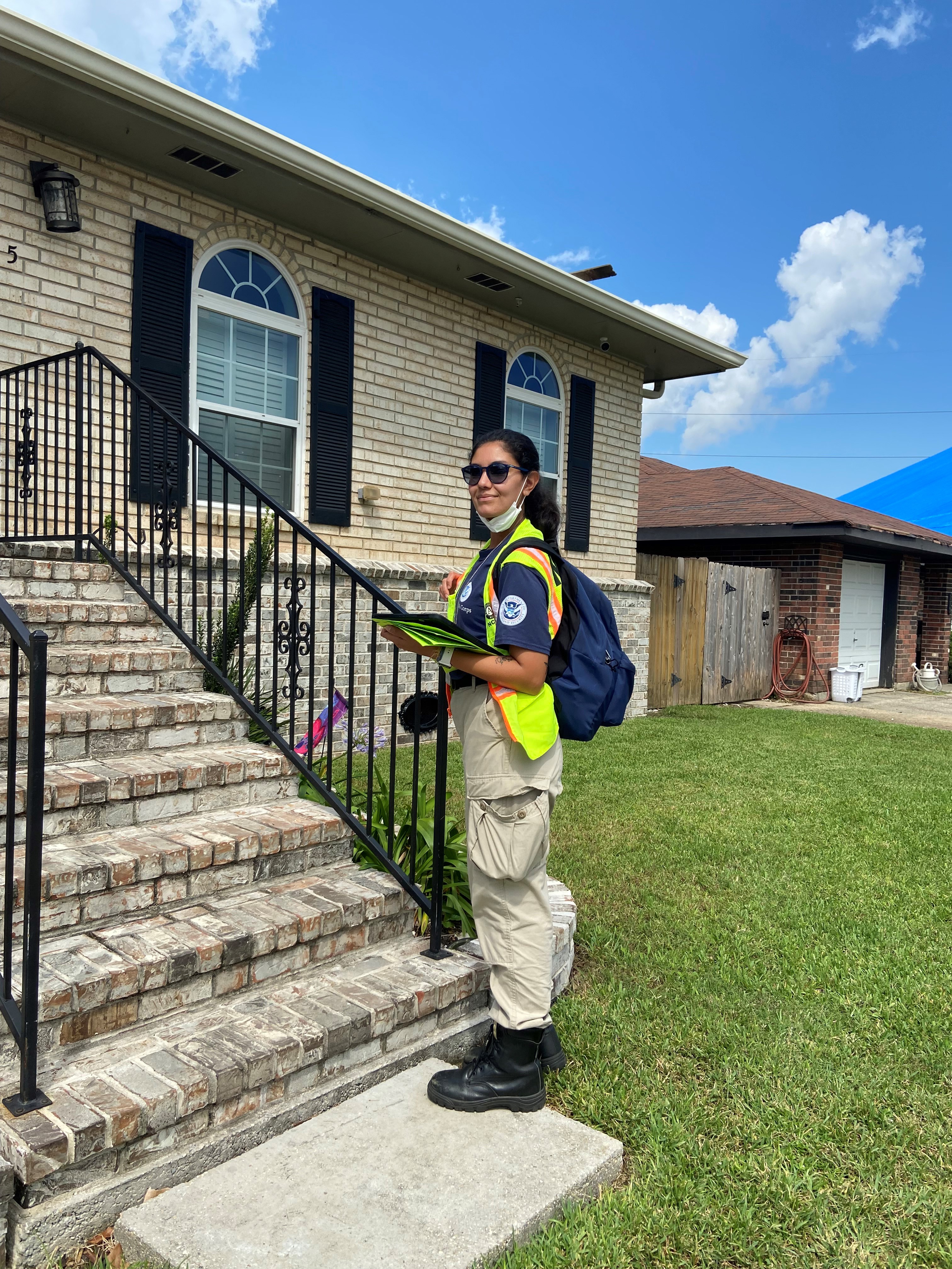 FEMA Corps member canvases house