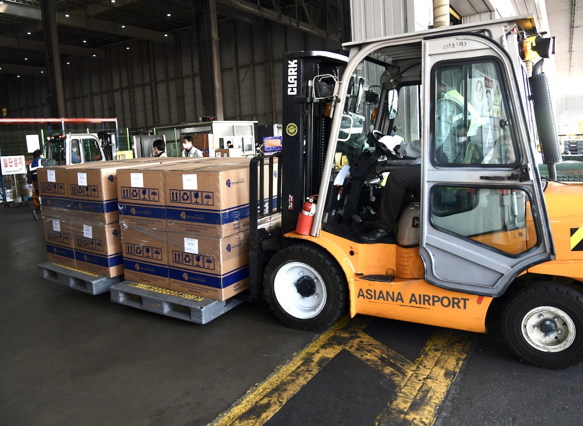 Small fork lift moves boxes of supplies. 