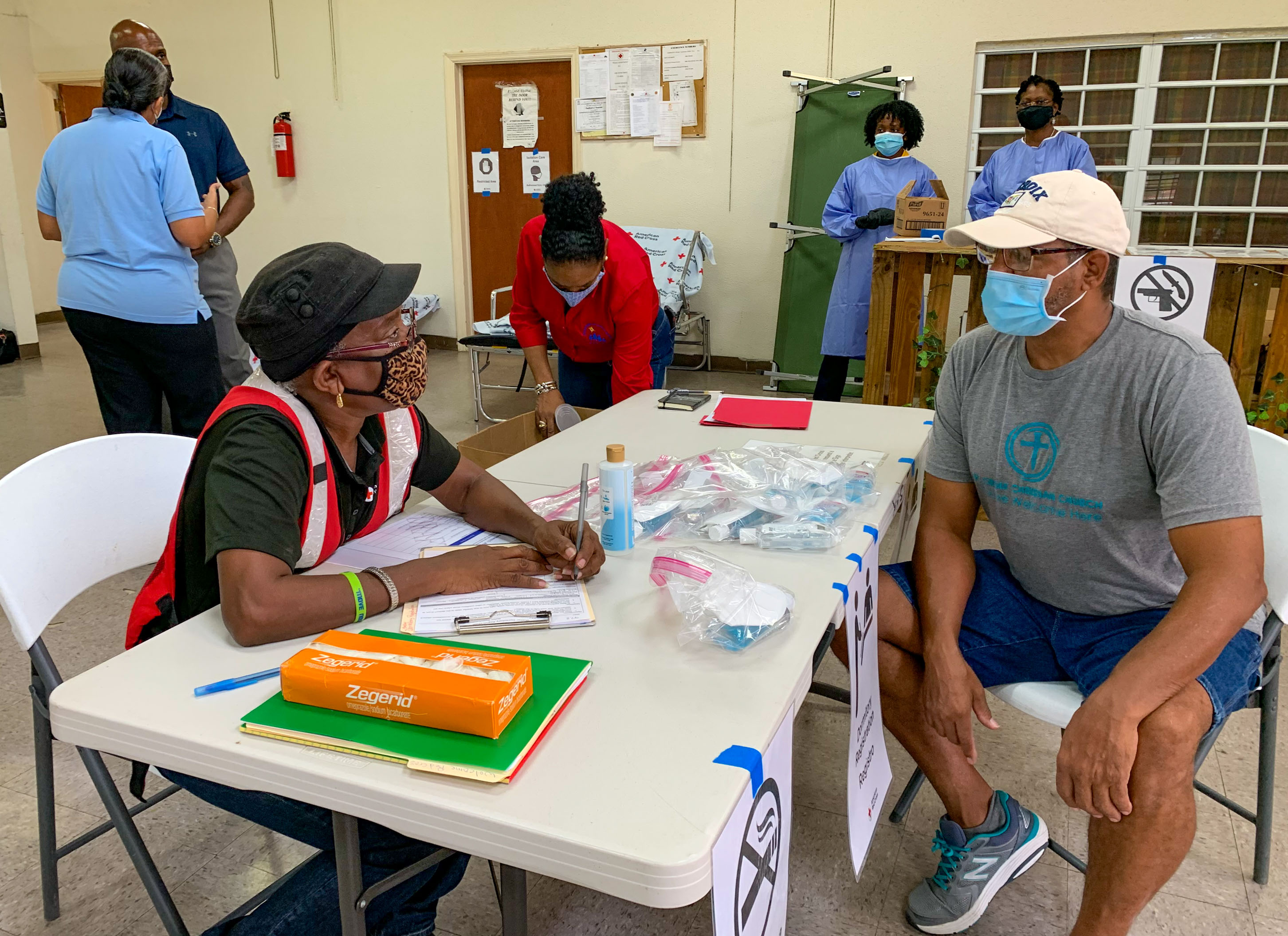 A volunteer role playing an evacuee looks to register at the D.C. Canegata Recreation Center shelter during an evacuation shelter drill. Members of the Voluntary Organizations Active in Disaster role played evacuees during the field exercise.
