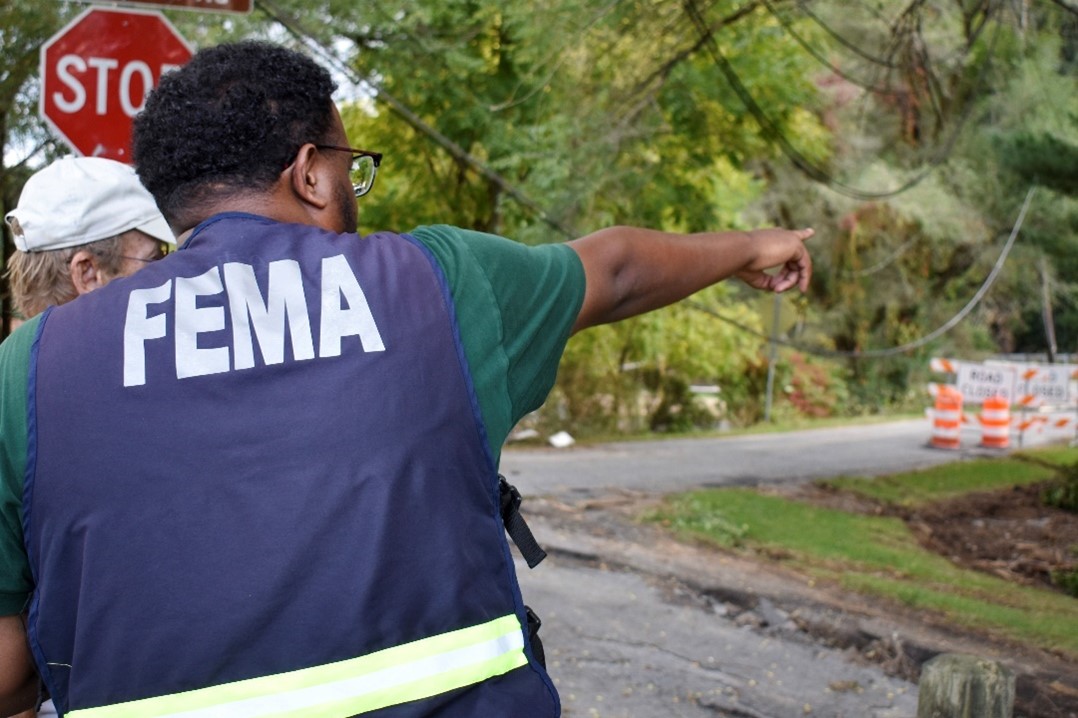 A FEMA Disaster Survivor Assistance Specialist speaks with a Damascus, Va., resident regarding his destroyed home on Oct. 3, 2024. A FEMA Disaster Survivor Assistance Team arrived in Damascus to help survivors of Tropical Storm Helene apply for federal aid. 