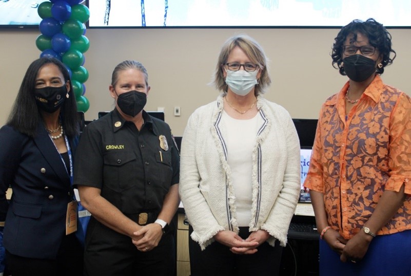 FEMA Administrator at HERricane Conference with two ladies to the left  of her and one on the right. 