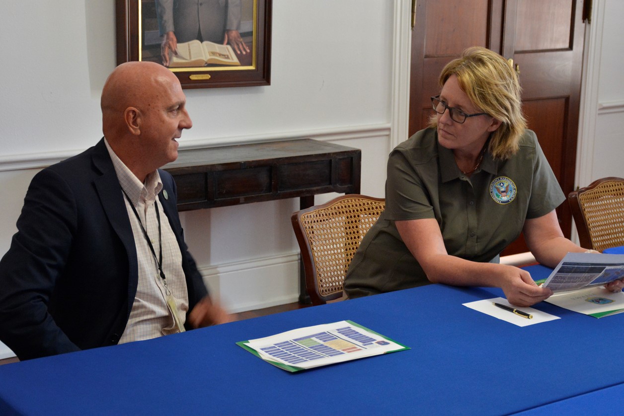 FEMA Administrator Deanne Criswell discusses the territory’s hurricane preparedness and ongoing response efforts with VITEMA Director Daryl Jaschen in a meeting at Government House on St. Croix.