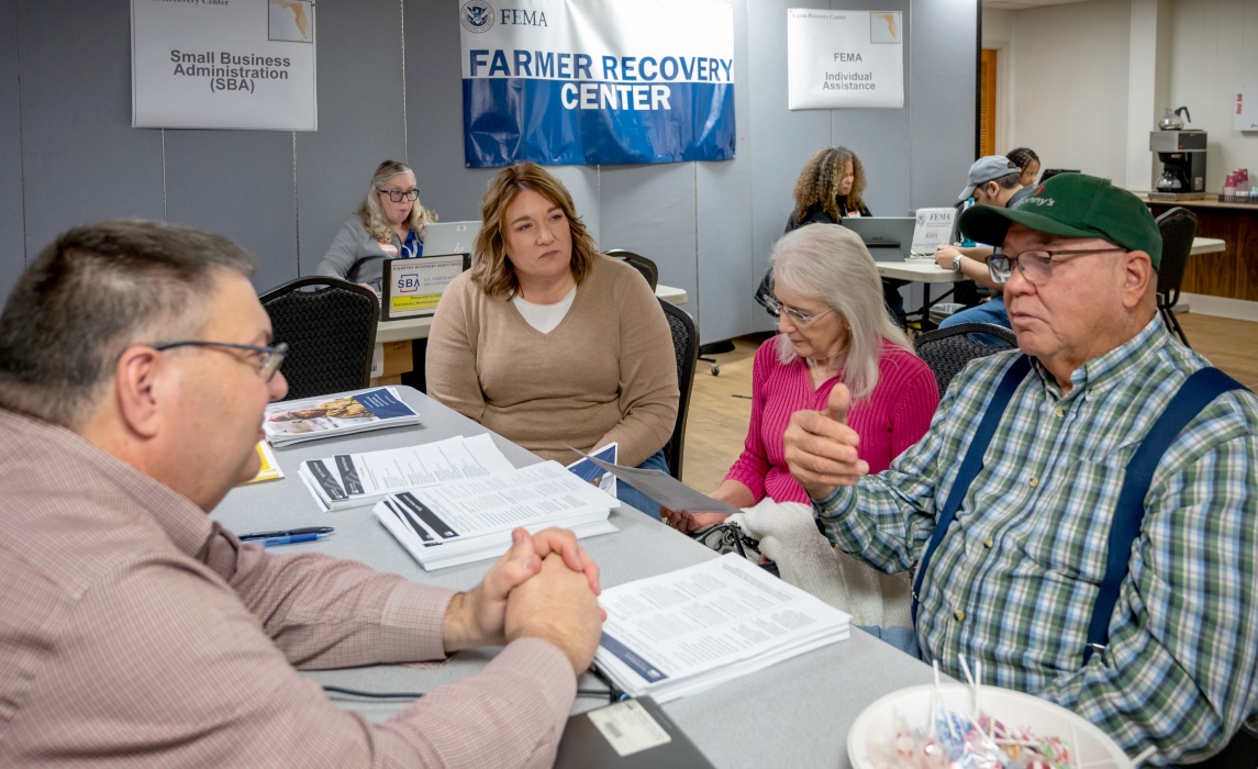 Florida disaster survivors stop by a Farm Recovery Center to learn more about the disaster assistance process. 