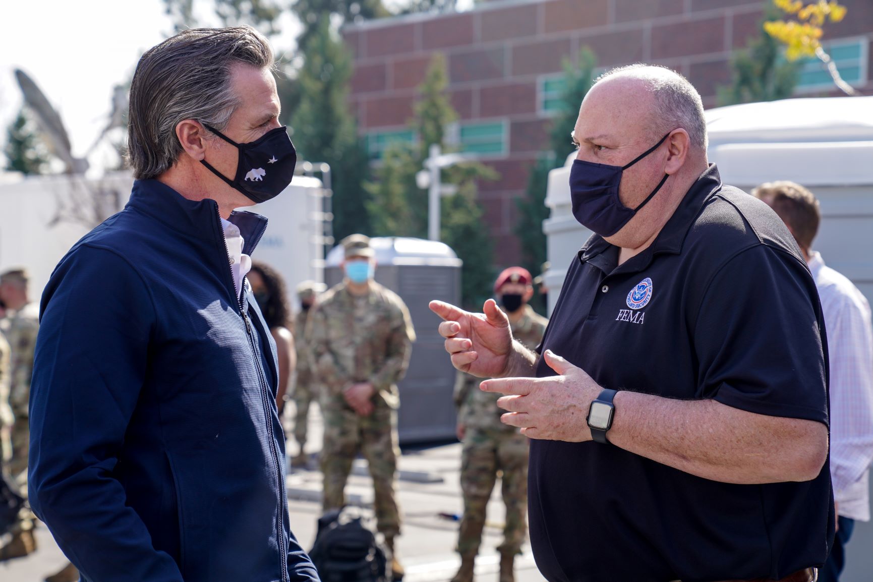 Acting FEMA Administrator talking to a state partner at a community vaccination center