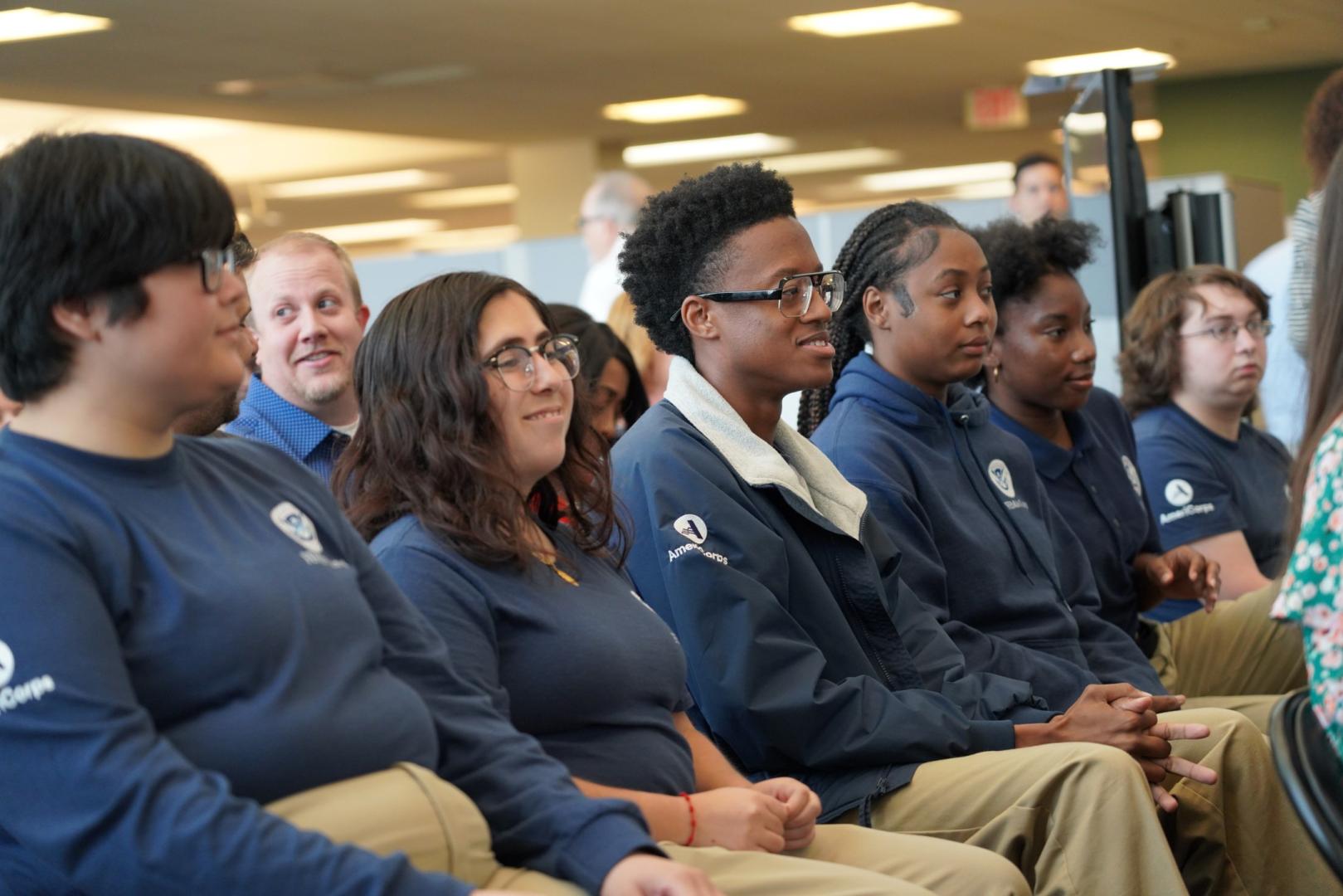 FEMA Corps members sitting in a row