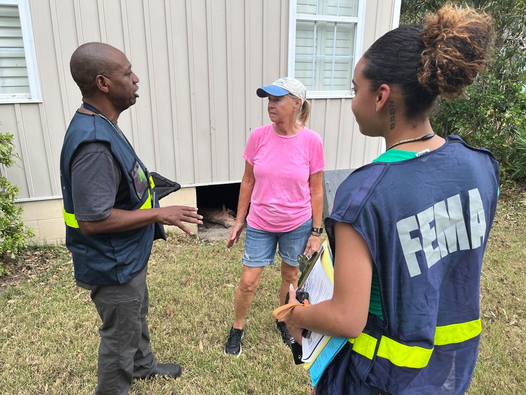 FEMA staff talking to survivors