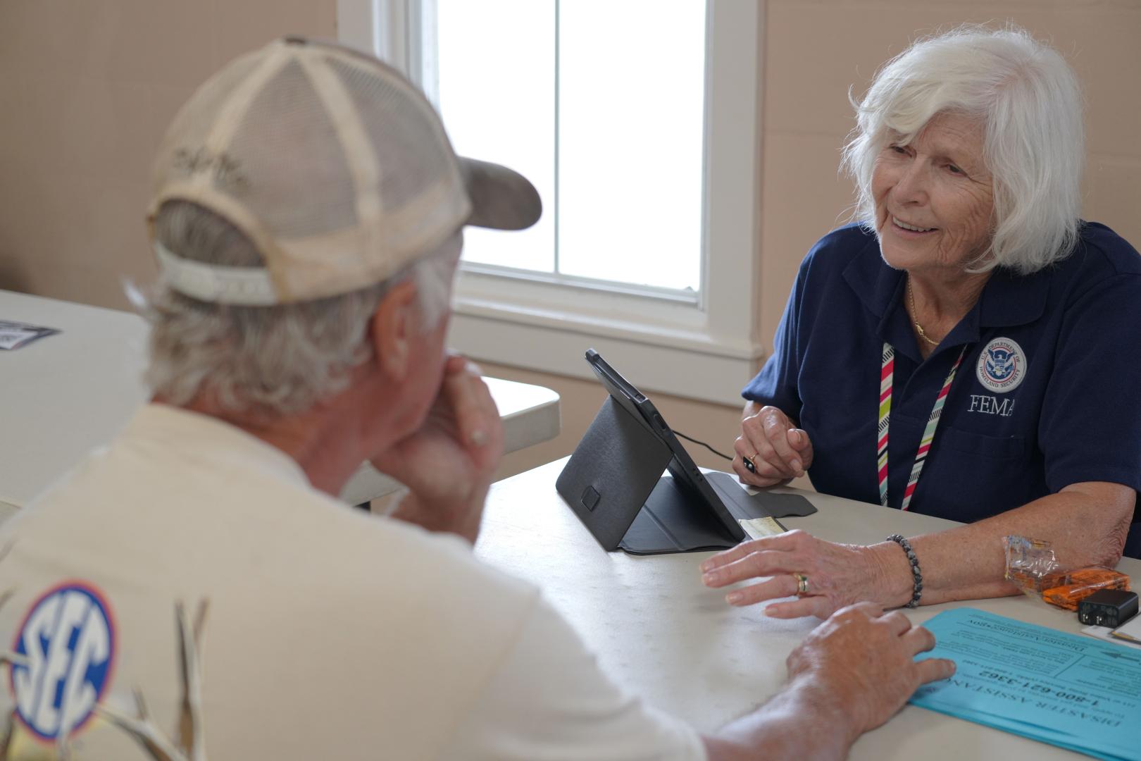 FEMA speaks with a Hurricane Helene survivor. 