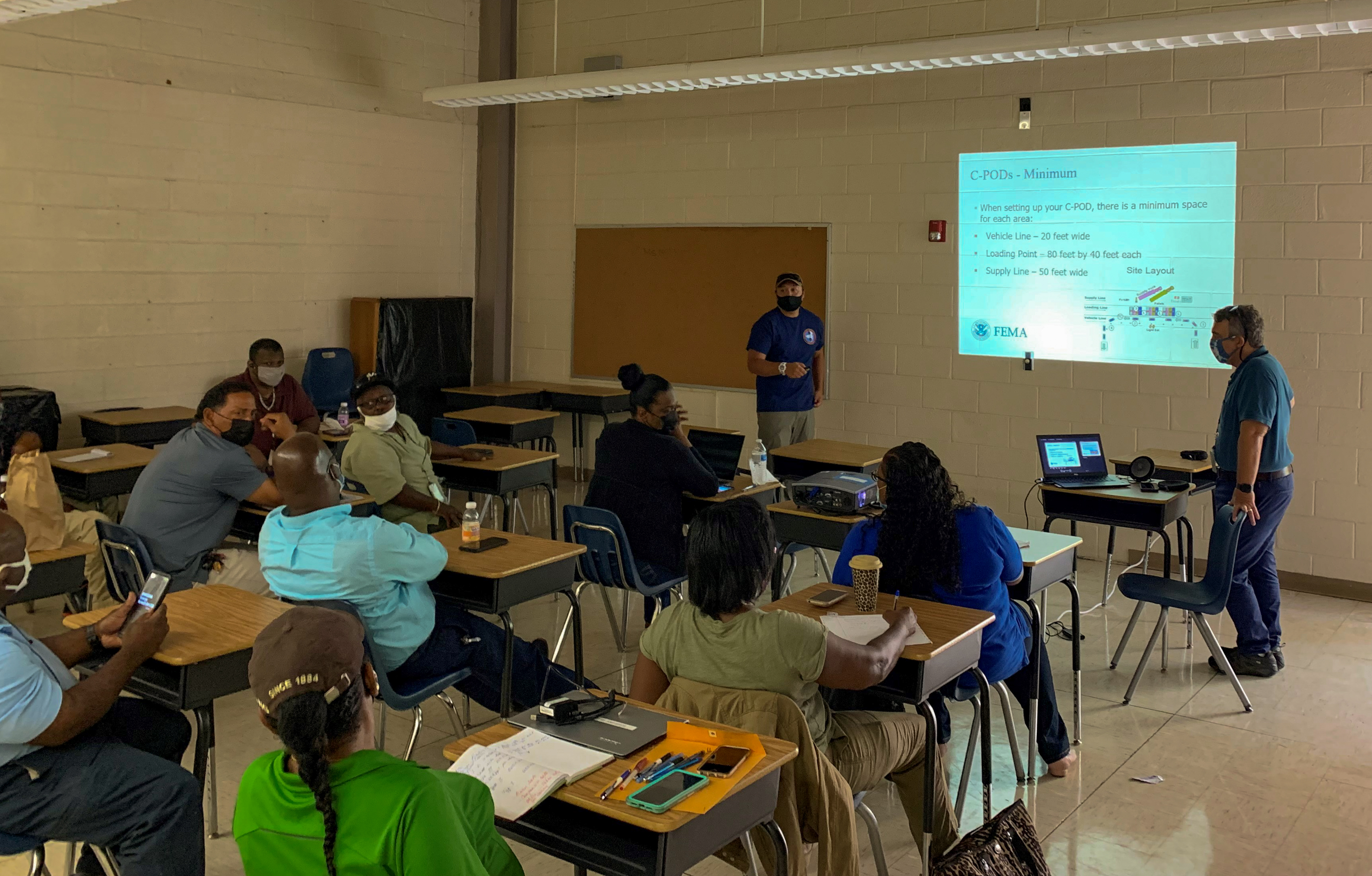 Members of Region 2's Incident Management Assistance Team lead a class on Community Points of Distribution for FEMA's U.S. Virgin Islands logistics staff and territorial partners from the Virgin Islands Territorial Emergency Management Agency and the U.S. Virgin Islands Department of Human Services at Bertha C. Boschulte Middle School. 
