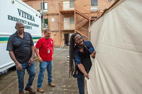 Caption: <p>St. Croix, U.S. Virgin Islands, May 22, 2024 -- Leon Lewis, Warehouse Manager and General Supply Specialist; George Hamilton, Logistics Facilities Lead; and Chris Brant, Region 2 Information Technology Specialist, help set up an expedient operations site on May 22 outside the Virgin Islands Territorial Emergency Management Agency’s Emergency Operations Center on St. Croix in preparation for the following day's hurricane readiness CAPSTONE exercise. FEMA/Angelique Smythe</p>