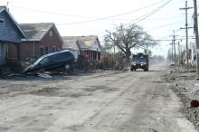 - A military Humvee patrols a road now cleaned of sludge and mud in a heavily damaged area of the Parish.