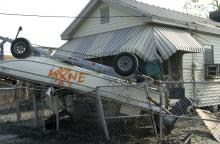  Hurricane Katrina put this boat upside down in this person's yard. 