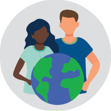 Woman and man holding a globe