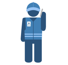 A blue fema inspector with a phone to his ear