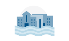Group of buildings with a river running in front of it