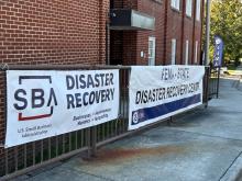 Two signs in front of the Wytheville Disaster Recovery Center, one that says SBA (U.S. Small Business Administration) Disaster Recovery and the other that says FEMA-State Disaster Recovery Center.