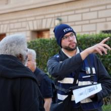 A DSAT member talks to a disaster survivor.