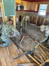 Soldiers assigned to 2nd Battalion, 502nd Infantry Regiment, 2nd Mobile Brigade, 101st Airborne Division help with cleaning up a house. 