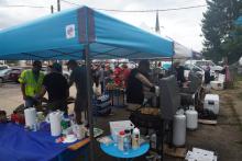 Volunteers serve hot food to survivors in downtown Swannanoa. 