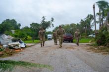 Soldiers from the Florida and South Carolina National Guard search for residents in need of assistance near Stuart after Hurricane Milton