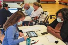 survivors meet with FEMA employees