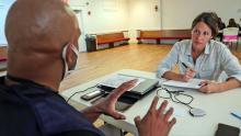 FEMA employee meets with a survivor