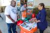 FEMA Emergency Management Specialist hands out literature to residents at the Elmont Home Depot as part of the third annual Hurricane Preparedness Workshops. More than 700 Home Depot stores from the Gulf Coast to New England participated; FEMA employees volunteered at many of the Home Depot locations for the one-day event that served to raise awareness and help residents prepare for hurricane season, which begins June 1. K.C.Wilsey/FEMA